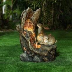 LuxenHome Resin Two Bunnies Tree Stump Outdoor Fountain With LED Lights